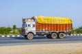 Cargo transport with tractor on country road Royalty Free Stock Photo