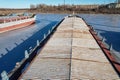 Cargo transportation. Old cargo ship. View from the steering bridge. Winter layup of ships at the mouth of the Volga River in Royalty Free Stock Photo