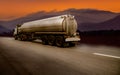 Cargo truck with heavy container speed on high way road to delivery logistic business with sun sky background. Royalty Free Stock Photo