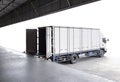 Cargo Truck Parked Loading Package Boxes at Dock Warehouse. Cargo Shipment. Industry Freight Truck Transportation. Logistics. Royalty Free Stock Photo