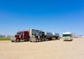 Cargo trucks and a motor-home parked at a rest area in canada