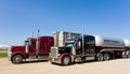 Cargo trucks parked at a rest area in canada