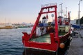 Cargo tug at the harbor pier. Sea port, boats and cranes Royalty Free Stock Photo