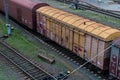 Cargo wagon, railway carriage, rail freight cars on rails Royalty Free Stock Photo