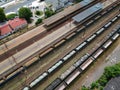 Cargo wagons on train station in city, aerial view Royalty Free Stock Photo