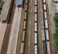 Cargo wagons on train station in city, aerial view Royalty Free Stock Photo