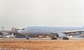 Cargo white aircraft without airline`s livery and logo on the runway