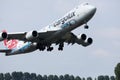 Cargolux jumbo Boeing B747 flying up in the sky