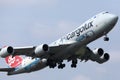 Cargolux jumbo Boeing B747 flying up in the sky