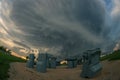 The Nebraska tourist attraction titled `Carhenge` with a severe thunderstorm in the background Royalty Free Stock Photo