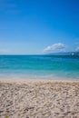 Caribbean beach with a lot of palms and white sand, Dominican Republic. Sunny warm day at the sea under palm trees. Sun loungers Royalty Free Stock Photo