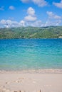 Caribbean beach with a lot of palms and white sand, Dominican Republic. Sunny warm day at the sea under palm trees. Sun loungers Royalty Free Stock Photo