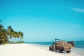 Tractor on the beach. tractor rides on the white sand