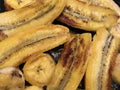 Caribbean cuisine Vegetarian dish yellow fried bananas - plane trees in butter or vegetable oil