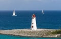 Caribbean Lighthouse With Sail Royalty Free Stock Photo