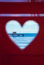 Caribbean Sea through Red Beach Bench Hearts Royalty Free Stock Photo