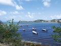 Caribbean sea with traditional fishing boats under tropical blue sky. Authentic and relaxed Caribbean landscape Royalty Free Stock Photo