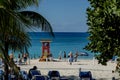 Caribbean Sun Retreat: Vacationers Revel in Serenity, Sunbathing Bliss on Great Stirrup Cay's Tropical Shores