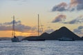 Caribbean sunset with sailboats and ferry at Soper`s Hole, West End, Tortola, BVI