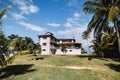 Caribbean themed cottages with back patios, white walkway. Small white country house for recreation