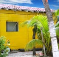 Caribbean tropical yellow beach wooden house