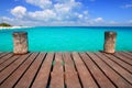 Caribbean wood pier with turquoise aqua sea