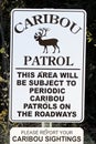 A caribou patrol sign indicating to report sightings Royalty Free Stock Photo