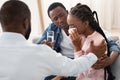 Caring Black Husband And Psychologist Comforting Crying Woman During Family Therapy Royalty Free Stock Photo