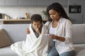 Caring Black Mom Checking Temperature Of Her Sick Son At Home Royalty Free Stock Photo