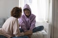 Caring mom talk with sad teenage daughter suffering at home Royalty Free Stock Photo