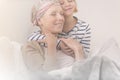 Child embracing mother with leukemia Royalty Free Stock Photo