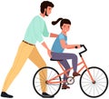 Caring dad teaching daughter to ride bike for first time. Father helping girl riding bicycle in park Royalty Free Stock Photo