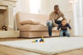 Caring daddy teaching his son walking Royalty Free Stock Photo