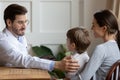 Caring doctor cheer small boy patient at consultation Royalty Free Stock Photo