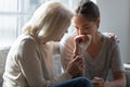 Caring elderly mom comfort adult depressed daughter Royalty Free Stock Photo