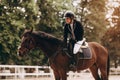 Caring equestrian. Caring professional equestrian calming his favorite horse before important horserace