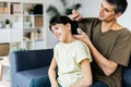 Caring father brushing his daughter hair at home. Royalty Free Stock Photo