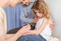 Caring father with cute little son during appointment with pediatrician