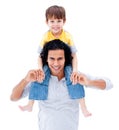 Caring father giving piggyback ride to his boy Royalty Free Stock Photo