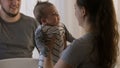 Mother takes newborn baby in bodysuit Royalty Free Stock Photo