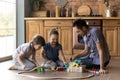 Caring father and two little kids playing with toys Royalty Free Stock Photo