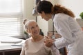 Caring female doctor comfort senior patient in hospital