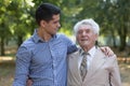 Caring grandson and his grandfather