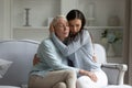 Loving adult daughter cuddle comfort upset mature mom Royalty Free Stock Photo