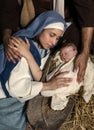Caring hands at Christmas nativity Royalty Free Stock Photo