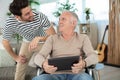 caring handsome son with disabled senior father Royalty Free Stock Photo