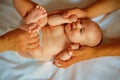 Always caring. Happy newborn baby given massage. Newborn boy or girl happy smiling. Pediatric care. Primary care Royalty Free Stock Photo