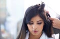 Caring for her hair. A young model at the hair salon having her done. Royalty Free Stock Photo