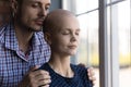 Caring husband hug support sick wife suffering from cancer Royalty Free Stock Photo