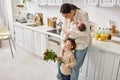 caring joyful family in housewear posing